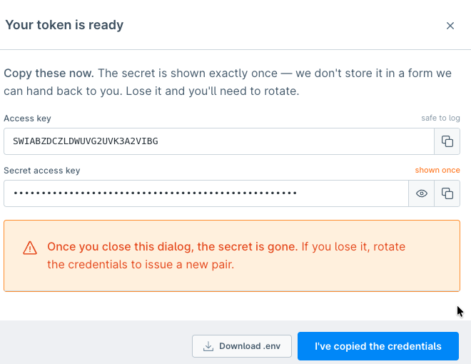 Modal showing the access key, the masked secret access key, and a warning that the secret is shown only once